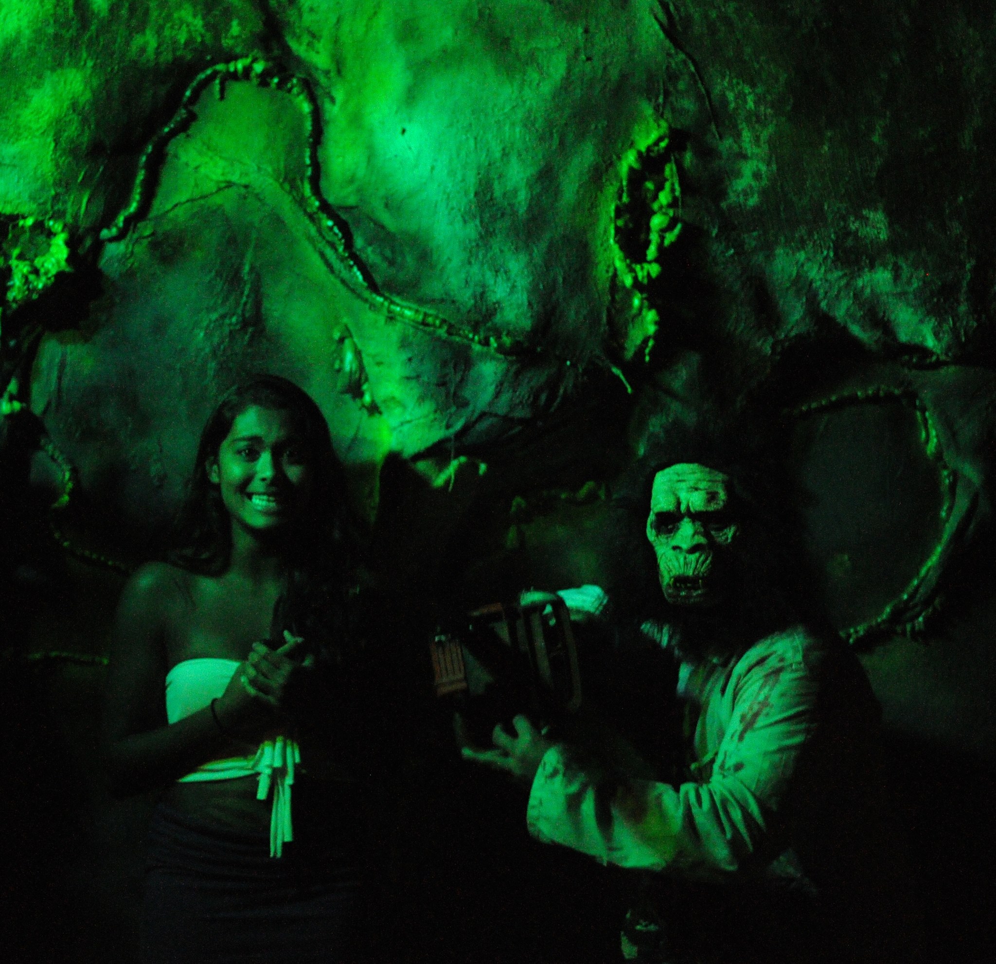 Monkey with a chainsaw taking pictures with a guest